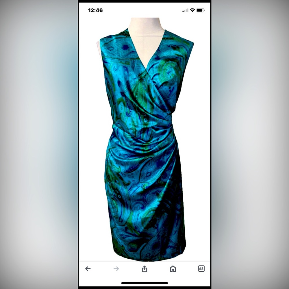Lovely teal dress, back zip, silky fabric. Comfortable and flattering.